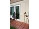 Exterior back door with brick pavers and a small window at 104 Gloucester Blvd # 340, Sun City Center, FL 33573