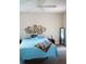 Bedroom featuring decorative wall baskets, wood floors and a blue accent pillow at 104 Gloucester Blvd # 340, Sun City Center, FL 33573