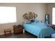 Bedroom showcasing wood floors and a decorative basket weave headboard at 104 Gloucester Blvd # 340, Sun City Center, FL 33573