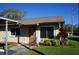 Charming single-story home features a well-manicured lawn and inviting entryway at 104 Gloucester Blvd # 340, Sun City Center, FL 33573
