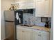 Modern kitchen features stainless steel appliances and granite countertops at 104 Gloucester Blvd # 340, Sun City Center, FL 33573