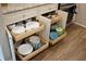 Kitchen cabinets featuring pull out drawers and shelves for dishes and kitchenware at 104 Gloucester Blvd # 340, Sun City Center, FL 33573