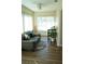 Cozy living room with many windows for natural light, a leather couch, and desk at 104 Gloucester Blvd # 340, Sun City Center, FL 33573