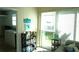 Bright living room with a sliding glass door and lots of natural light at 104 Gloucester Blvd # 340, Sun City Center, FL 33573