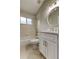 Neutral bathroom with a vanity, a mirror and a shower/tub combo with tile at 10614 Chambers Dr, Tampa, FL 33626