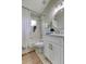 Bright bathroom featuring a shower-tub combination, white vanity, and decorative accents at 10614 Chambers Dr, Tampa, FL 33626