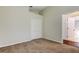 Cozy bedroom with plush carpeting and view into the hallway at 10614 Chambers Dr, Tampa, FL 33626