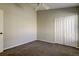 Clean bedroom with carpet, and a double door closet at 10614 Chambers Dr, Tampa, FL 33626