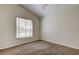 Neutral bedroom featuring natural light from a window and neutral carpeting at 10614 Chambers Dr, Tampa, FL 33626