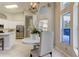 Bright dining area next to the kitchen featuring pendant lighting and views of the kitchen appliances at 10614 Chambers Dr, Tampa, FL 33626
