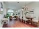 Elegant dining room with wood floors, modern decor, and lots of natural light at 10614 Chambers Dr, Tampa, FL 33626
