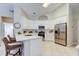 Contemporary kitchen with white quartz countertops, stainless steel appliances, and breakfast bar seating at 10614 Chambers Dr, Tampa, FL 33626