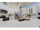 Spacious kitchen island features quartz countertops, stainless steel appliances and bright lighting at 10614 Chambers Dr, Tampa, FL 33626