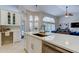 Open-concept kitchen featuring ample counter space with a view into the dining and living area at 10614 Chambers Dr, Tampa, FL 33626