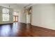 Bright living area featuring hardwood floors, high ceilings, and beautiful entry door at 10614 Chambers Dr, Tampa, FL 33626