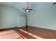 Bright living room features hardwood floors, ceiling fan, and ample space for entertaining and relaxation at 10614 Chambers Dr, Tampa, FL 33626