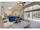 Bright living room features hardwood floors, a large window and view of the outdoor pool area at 10614 Chambers Dr, Tampa, FL 33626