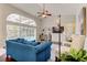 Bright and airy living room featuring a large window overlooking the pool and lush greenery at 10614 Chambers Dr, Tampa, FL 33626