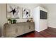 Stylish living room featuring modern decor, mounted TV, and warm wood floors at 10614 Chambers Dr, Tampa, FL 33626