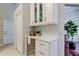Office nook with custom cabinets, drawers, and shelving offering plenty of storage and a workspace at 10614 Chambers Dr, Tampa, FL 33626