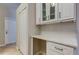 Bright butler's pantry features white cabinetry, ample storage, and a clean, stylish design at 10614 Chambers Dr, Tampa, FL 33626