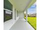 Covered back patio overlooking the green backyard at 11885 Richmond Trl, Parrish, FL 34219