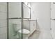 Modern bathroom features a tiled shower, white vanity, and neutral flooring at 11885 Richmond Trl, Parrish, FL 34219