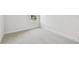 Bright bedroom showcasing plush carpeting and a window view at 11885 Richmond Trl, Parrish, FL 34219