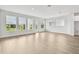 Spacious living room featuring ample natural light through large windows and a glass door overlooking the backyard at 11885 Richmond Trl, Parrish, FL 34219