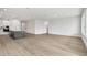 Expansive living area with kitchen view, showcasing modern design and open concept layout at 11885 Richmond Trl, Parrish, FL 34219