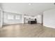 Open floor plan showing living room and kitchen, enhanced by natural light and seamless flow at 11885 Richmond Trl, Parrish, FL 34219