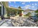 This backyard features a spacious patio, lush lawn, and stylish outdoor furniture at 1514 River Ct, Tarpon Springs, FL 34689