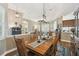 Formal dining room boasts wood floors, detailed trim, and designer lighting at 1514 River Ct, Tarpon Springs, FL 34689