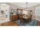 Elegant dining room featuring hardwood floors, a decorative rug, and a stylish table at 1514 River Ct, Tarpon Springs, FL 34689