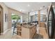 Bright kitchen with granite counters, center island with sink, and stainless steel appliances at 1514 River Ct, Tarpon Springs, FL 34689