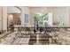 Kitchen sink with granite countertops and view of the back yard patio and BBQ at 1514 River Ct, Tarpon Springs, FL 34689