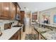 Spacious kitchen featuring granite countertops, stainless steel appliances, and ample cabinet space at 1514 River Ct, Tarpon Springs, FL 34689