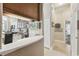 Open kitchen view from hallway, showcasing counter space and stainless appliances in a functional design at 1514 River Ct, Tarpon Springs, FL 34689