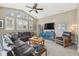 Comfortable living room area is nicely furnished and provides lots of light at 1514 River Ct, Tarpon Springs, FL 34689