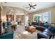 Open living room showcasing natural lighting, comfortable seating and adjoins the kitchen area at 1514 River Ct, Tarpon Springs, FL 34689