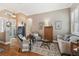 Inviting formal living room features hardwood floors, neutral paint, and ample sunlight at 1514 River Ct, Tarpon Springs, FL 34689