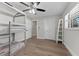 ' bedroom with a bunk bed, wood floors, and a ceiling fan for a fun, airy space at 1664 Sharon Way, Clearwater, FL 33764