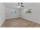 Bright, vacant bedroom with wood-look flooring and a ceiling fan at 1664 Sharon Way, Clearwater, FL 33764