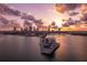 Stunning sunset aerial view of downtown city skyline over the water with modern pier extending into the ocean at 175 2Nd S St # P03, St Petersburg, FL 33701