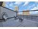 Spacious balcony with lounge chairs overlooking the ocean and city skyline at 175 2Nd S St # P03, St Petersburg, FL 33701