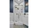 Updated bathroom with a glass shower enclosure, white subway tiles, and a modern sink at 175 2Nd S St # P03, St Petersburg, FL 33701