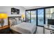 Bright bedroom with sliding glass doors to balcony offering stunning ocean views at 175 2Nd S St # P03, St Petersburg, FL 33701