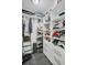 Walk-in closet with ample shelving, drawers, and storage solutions for optimal organization at 175 2Nd S St # P03, St Petersburg, FL 33701