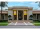 The Museum of Fine Arts entrance with architectural columns, brick sidewalk, and lush landscaping at 175 2Nd S St # P03, St Petersburg, FL 33701