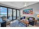 Relaxing living room with ocean view balcony, modern seating and stylish decor at 175 2Nd S St # P03, St Petersburg, FL 33701